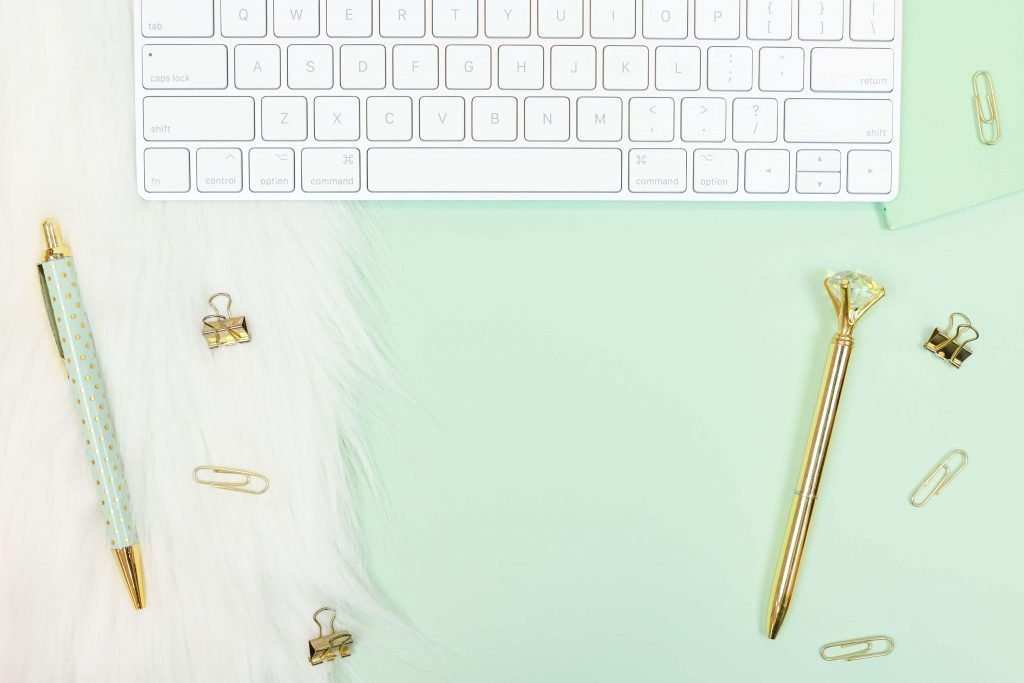 desk with keyboard and pens for using Pinterest for Business